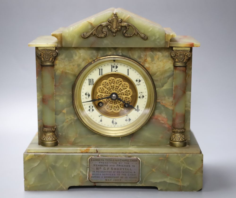 A late 19th century onyx cased eight day mantel clock, French gong-striking movement, presented 1903, 26cm wide